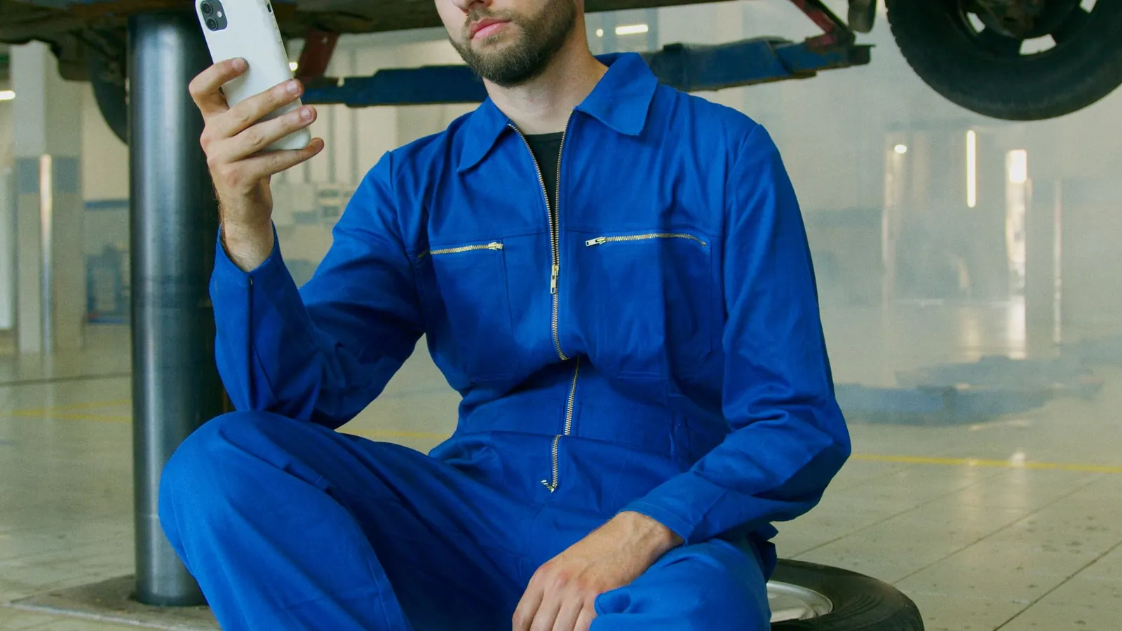 Trade professional checking business information on a smartphone