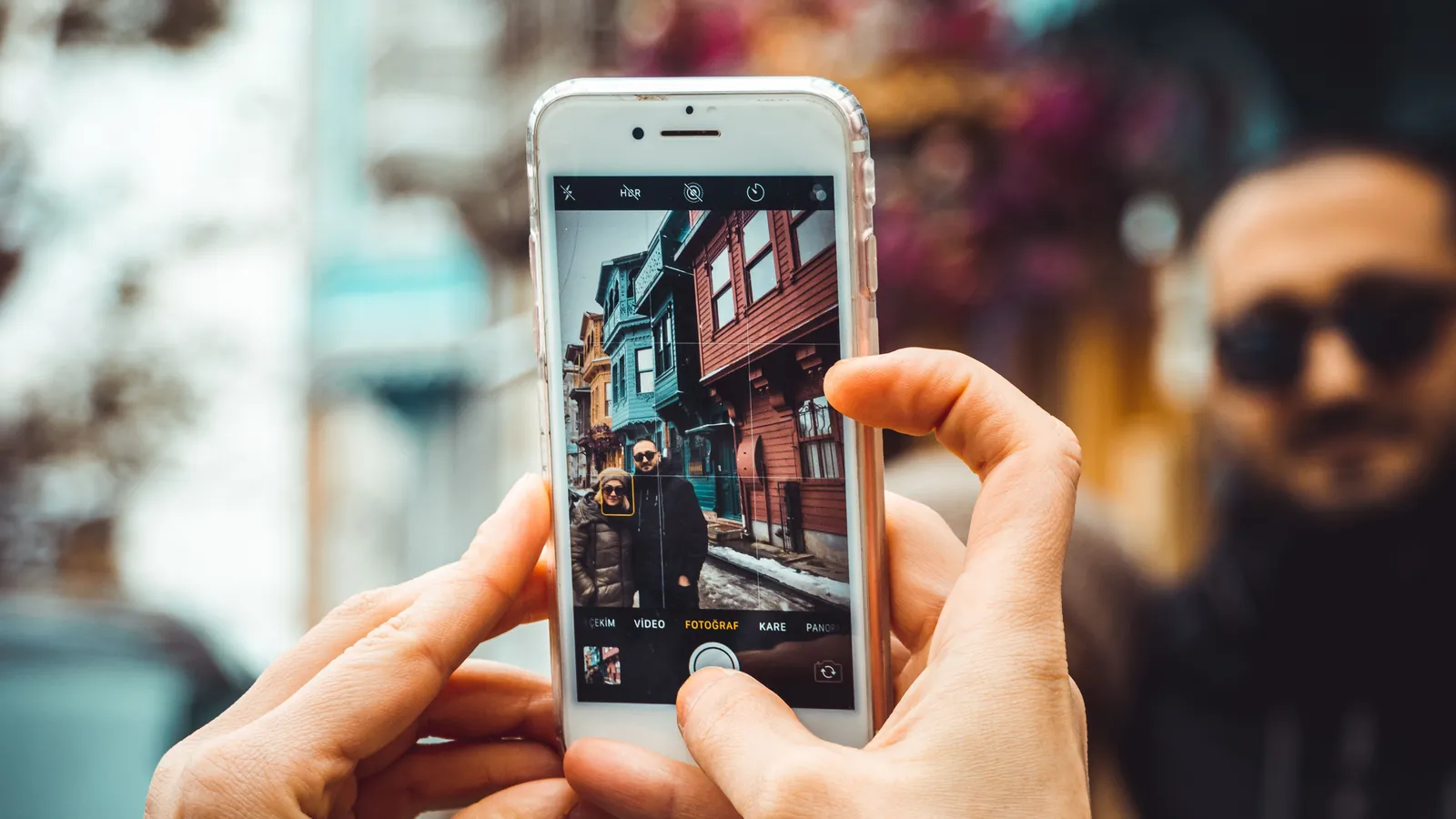Person taking a clear project photograph with a smartphone